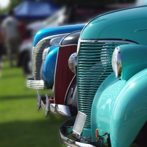 cars lined up at a vintage car show